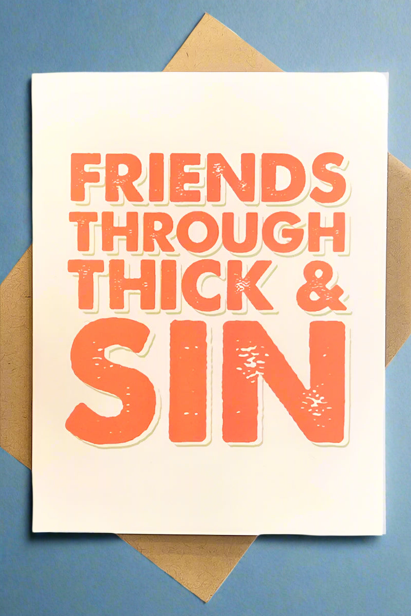 A yellow minimalist card that says “friends through thick & sin.”