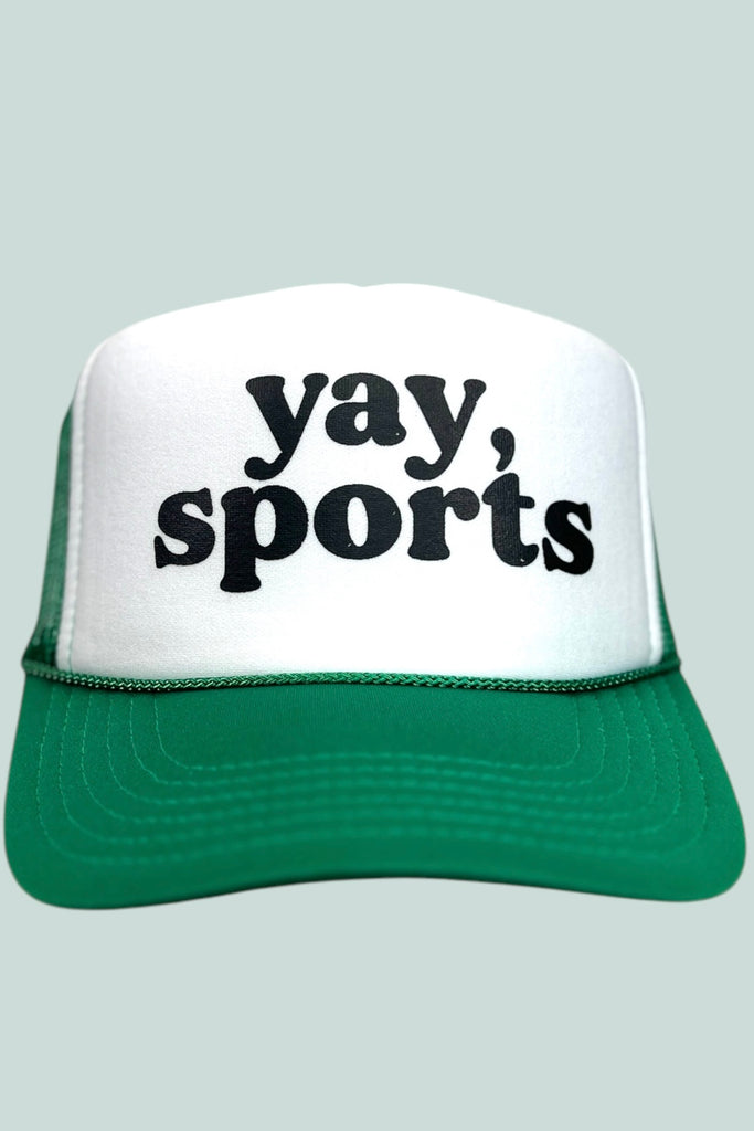 Green and white foam front trucker hat with the phrase "yay, sports" printed in black lettering. 