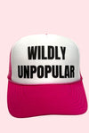 Hot pink and white trucker hat with black lettering that reads "Wildly Unpopular."