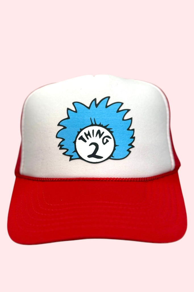 Red and white foam front trucker hat with "thing 2" printed on the front. 