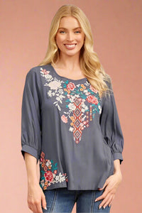 This charcoal blouse has 3/4 length sleeves and a round neckline. It is lightweight and features embroidered floral pattern.