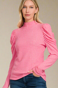 A puff sleeve, high neck top in Viva Pink. This is lightweight with long sleeves.