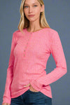 A womens basic lightweight long sleeve top in hot pink featuring a soft rib knit material and henley neckline.