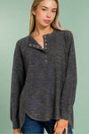 A women’s lightweight knit henley top in dark heather grey featuring a relaxed fit and high-low scoop hem.