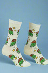 Pair of socks with cartoon frog design on a light background