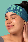 Soft teal headband featuring a unique mushroom print in a contrasting vibrant green color. 