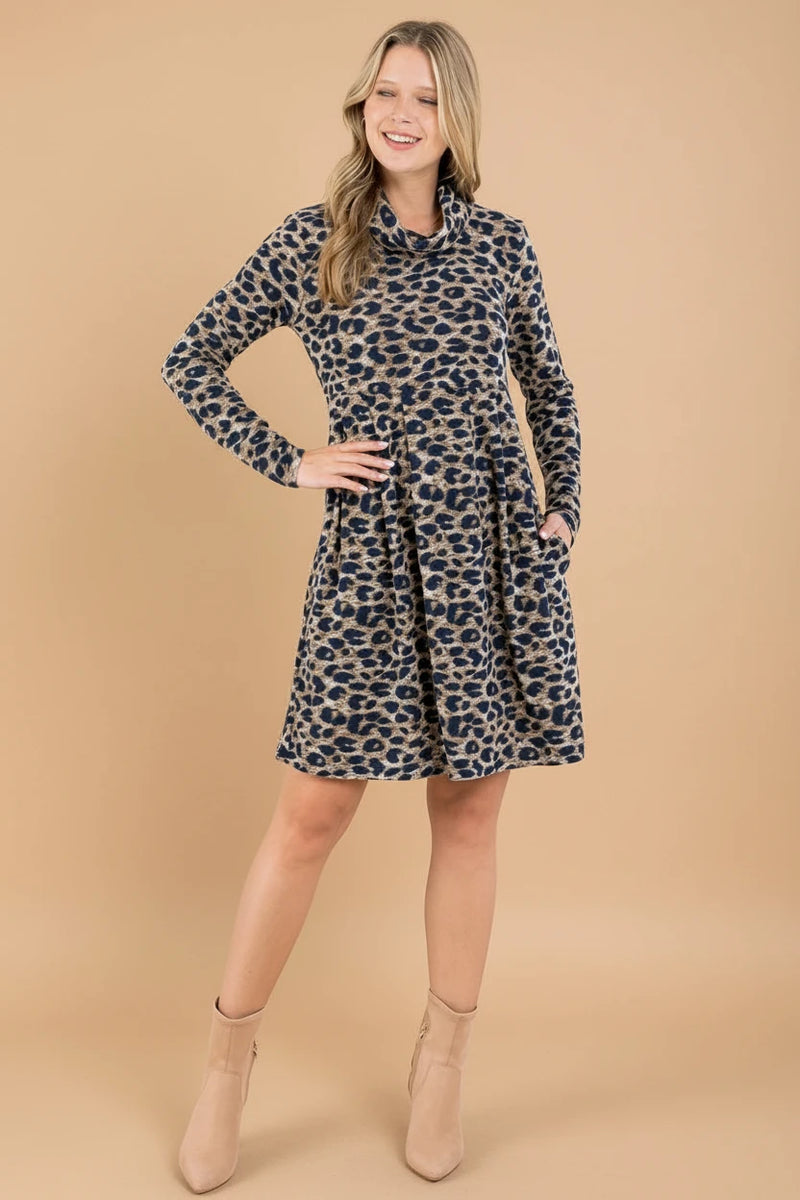 Woman wearing a leopard print dress in a minimalistic room.