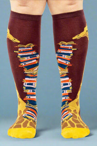 Knee-high socks with book and giraffe design on a white background