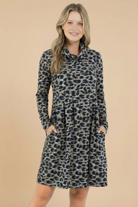 Woman wearing a leopard print dress against a white background