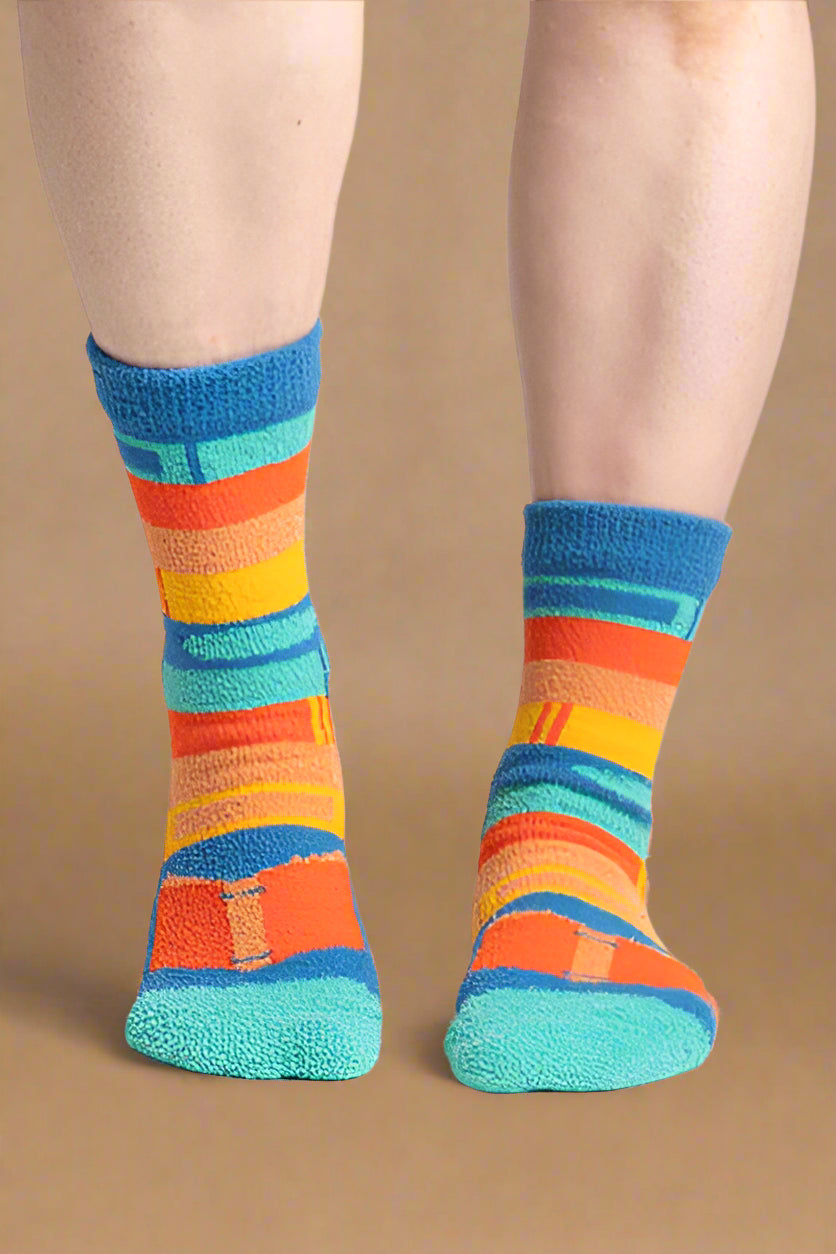 Colorful striped socks on a plain background