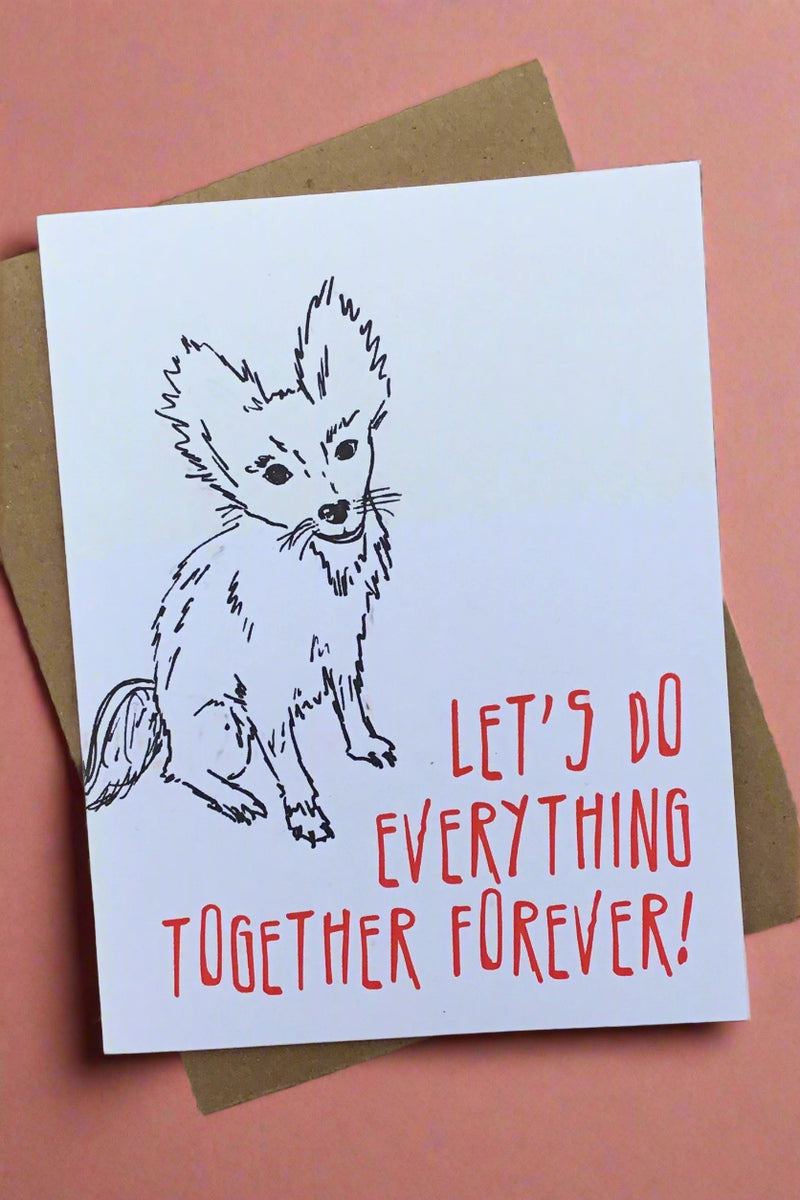 A white card with an image of a fox and says “Let’s do everything together forever!”
