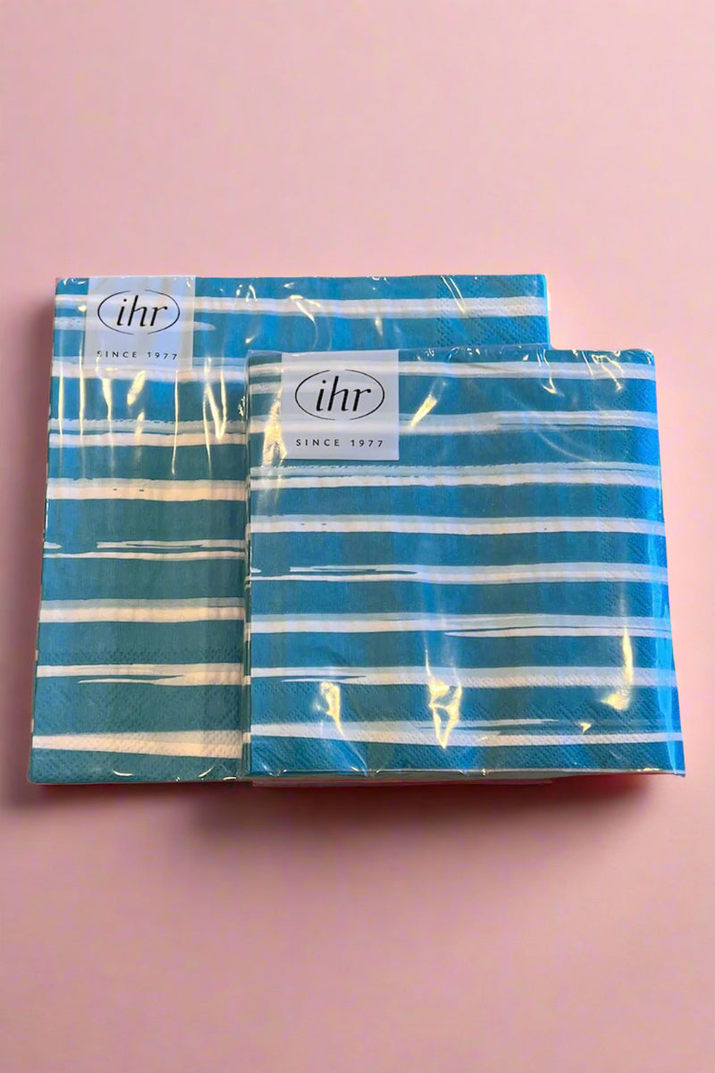 A set of paper cocktail and dinner napkins in bright blue and white striped print.