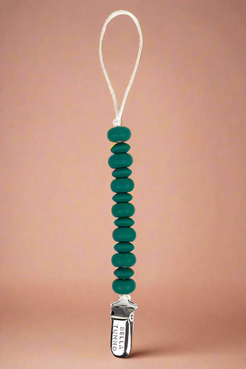 A beaded silicone Teether in green that is also a pacifier clip.