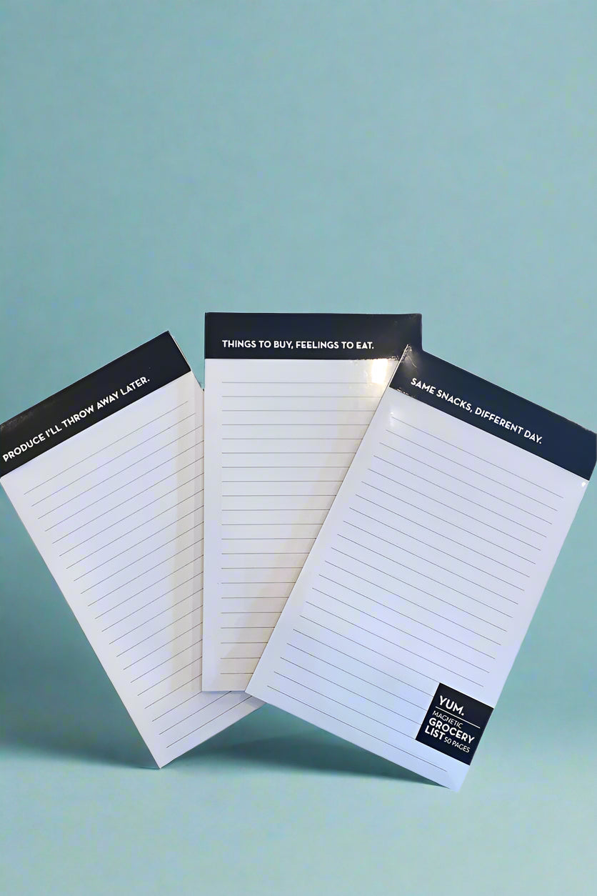Three magnetic note pads with funny sayings on the top.