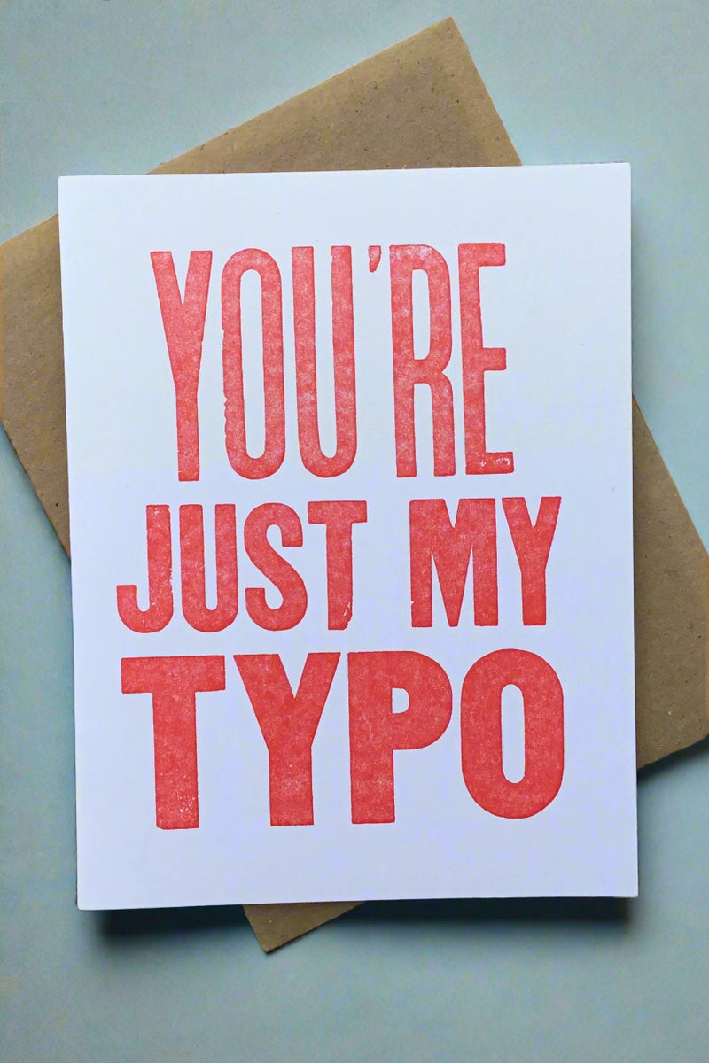 Card with red words saying “You’re just my typo.”