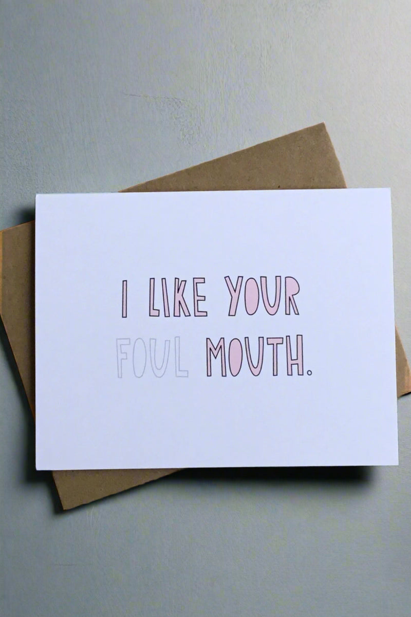 A simple white greeting card with text that reads ‘I like your foul mouth.’ The word ‘foul’ is more faint than the rest of the text.