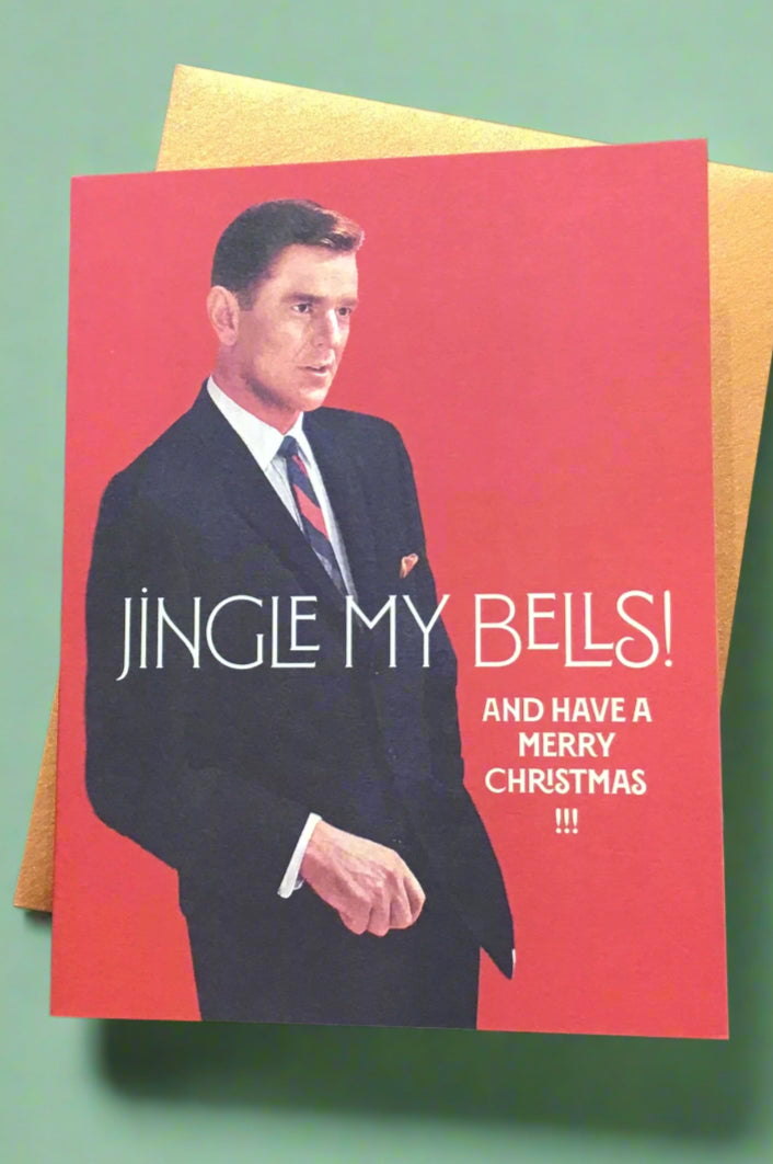 A red card with an image of a man in a suit and the words “ Jingle my bells! And have a Merry Christmas!!!”