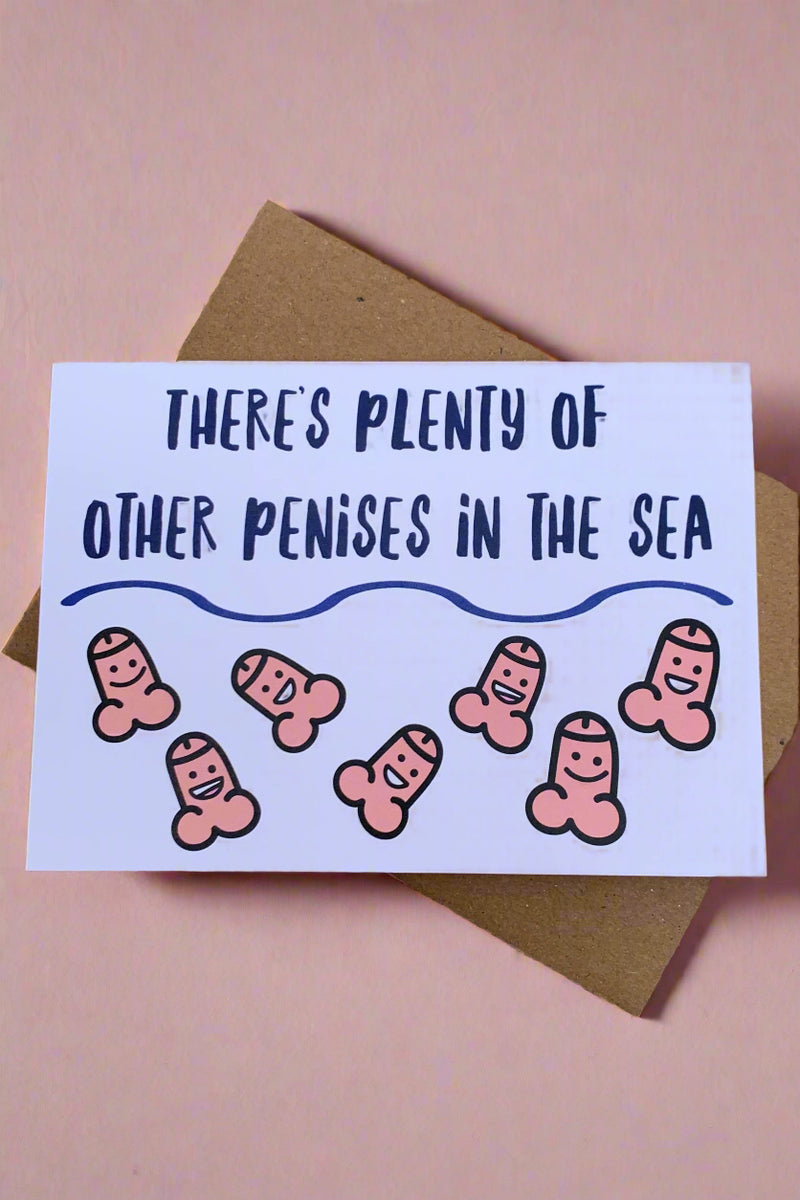 A white card with says “There's plenty of other penises in the sea.” And features tiny, smiling penises.