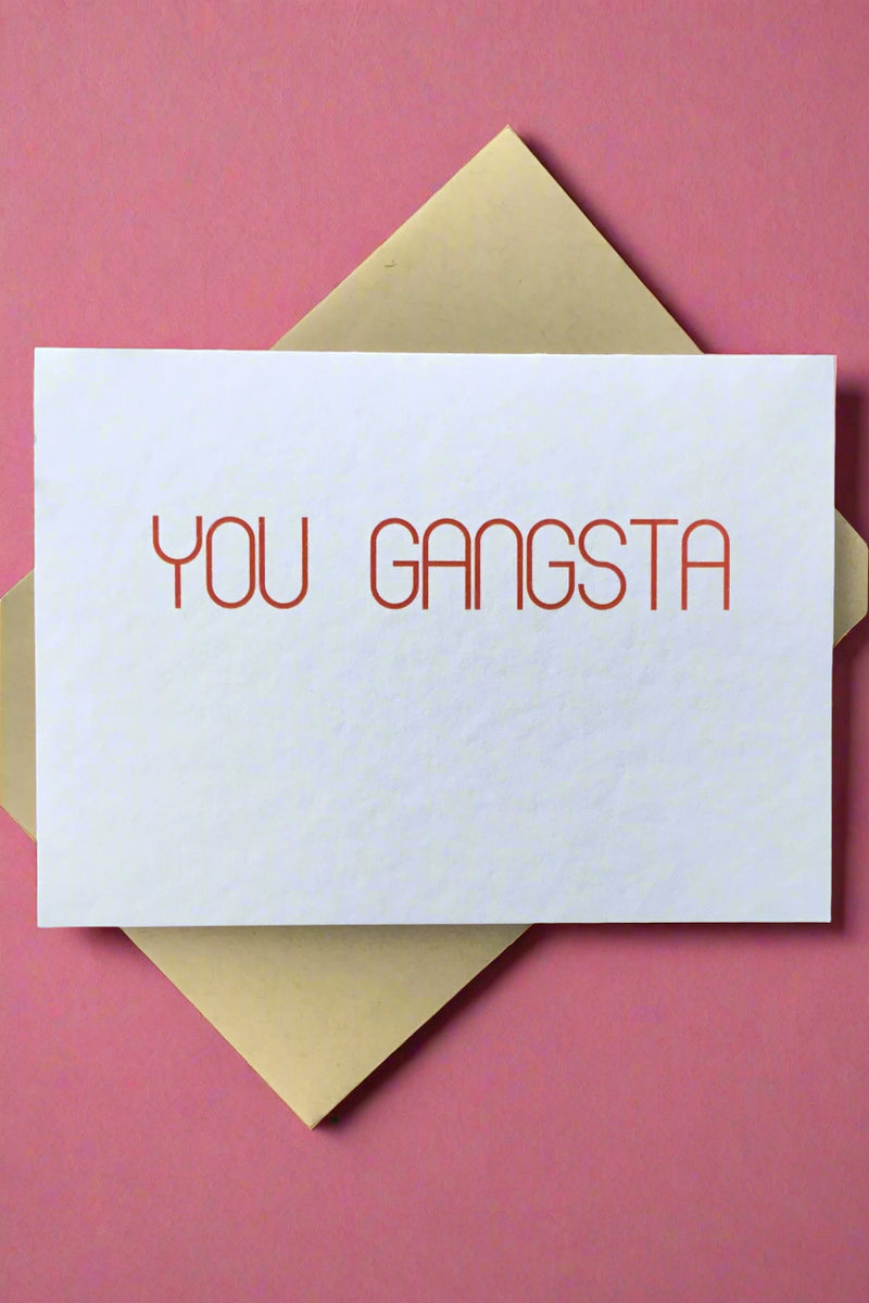 A whit minimalist card that says “you gangsta” in red letters.