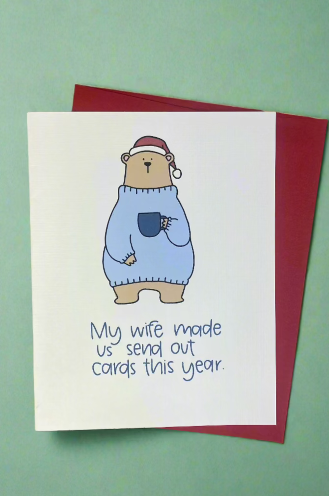 Card with bear wearing a Santa hat and the words “My Wife Made Us Send Out Cards This Year.”