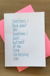 A white card that says “ Sometimes I think about you, sometimes I don’t. But most of the time I’m missing you.”