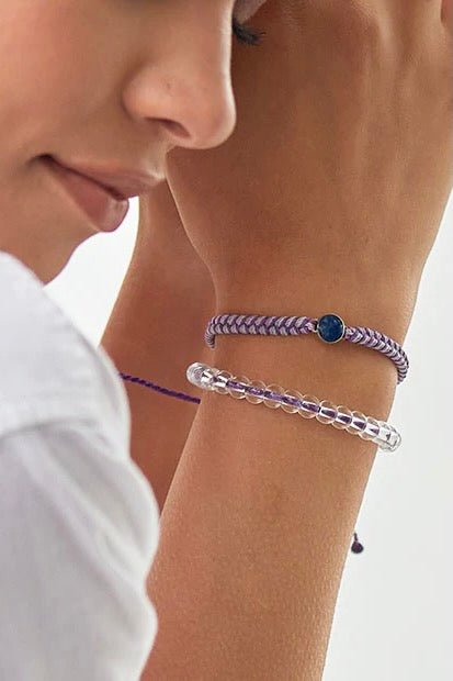 A recycled plastic bracelet in purple.