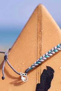 Grey and Teal braided bracelet with adjustable pulls and a small silver 4ocean charm. 