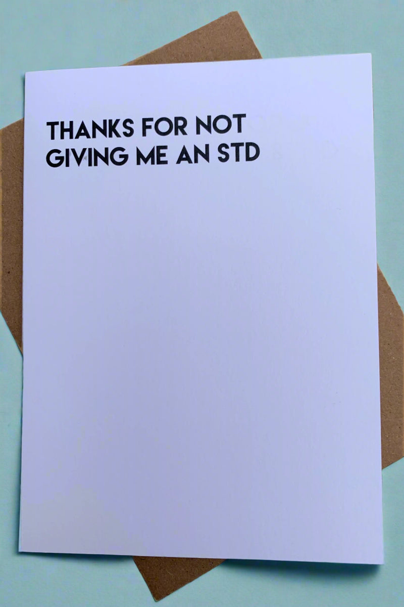 White minimalist card with the words “Thanks for not giving me an STD.“  