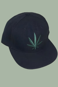 Black adjustable baseball cap with a green pot leaf embroidered on the front panel. 