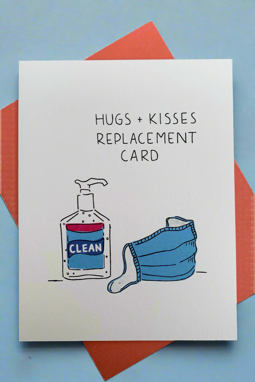 An off-white greeting card with images of a bottle of hand sanitizer and a medical paper mask and text that reads ‘Hugs + Kisses Replacement Card.’