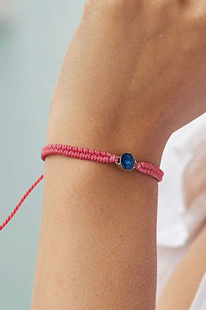 A recycled plastic bracelet in pink.