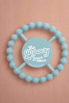 A blue, silicone Teether.