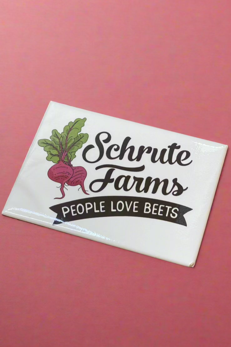 A The Office magnet that says “Schrute Farms - People Love Beats.”