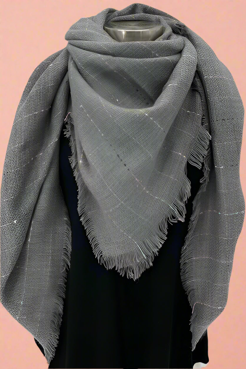 This blanket scarf has silver thread and tiny color thread pieces to add subtle color and sparkle in a casual way.  Soft and warm for a mildly chilly day.