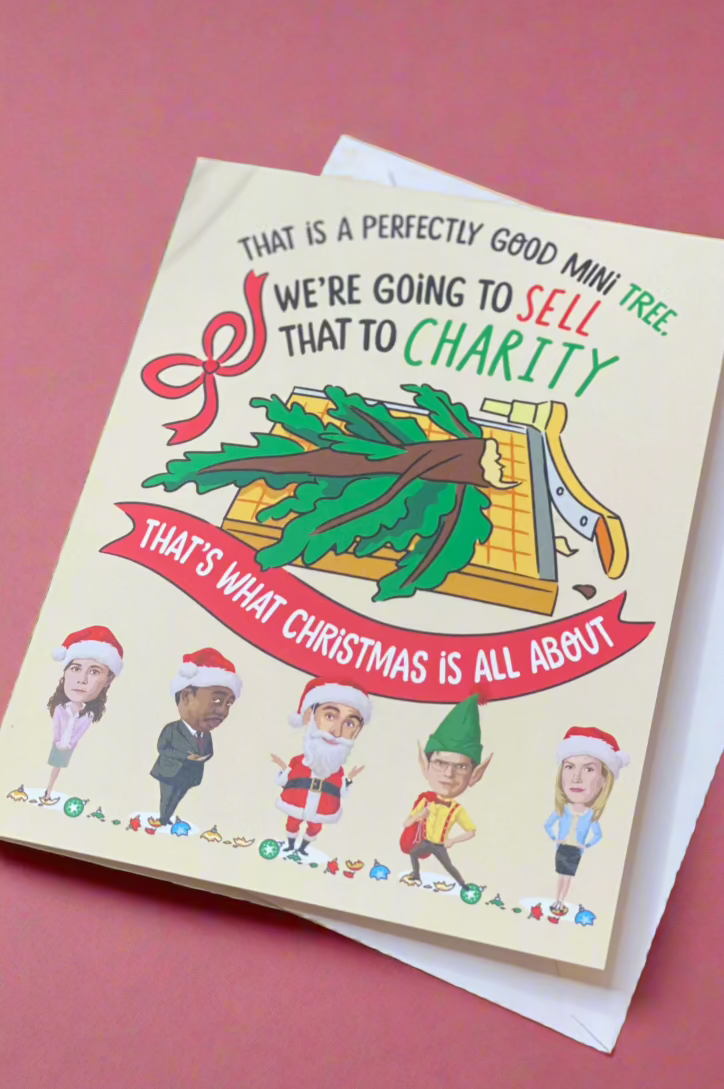 A The Office themed card with the words “That Is A Perfectly Good Mini Tree. We're Going To Sell That To Charity. That's What Christmas Is All About”