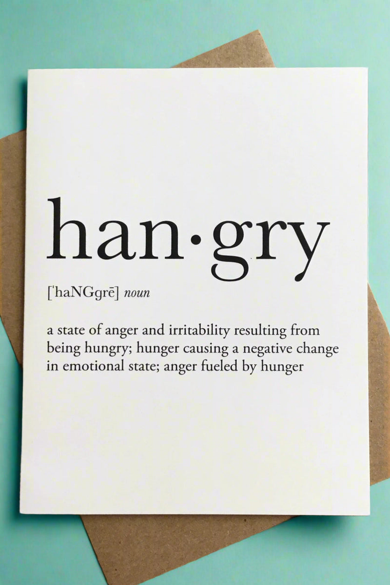 A simple greeting card in white with black text that reads ‘Hangry- a state of anger and irritability resulting from being hungry; hunger causing a negative change in emotional state; anger fueled by hunger’.
