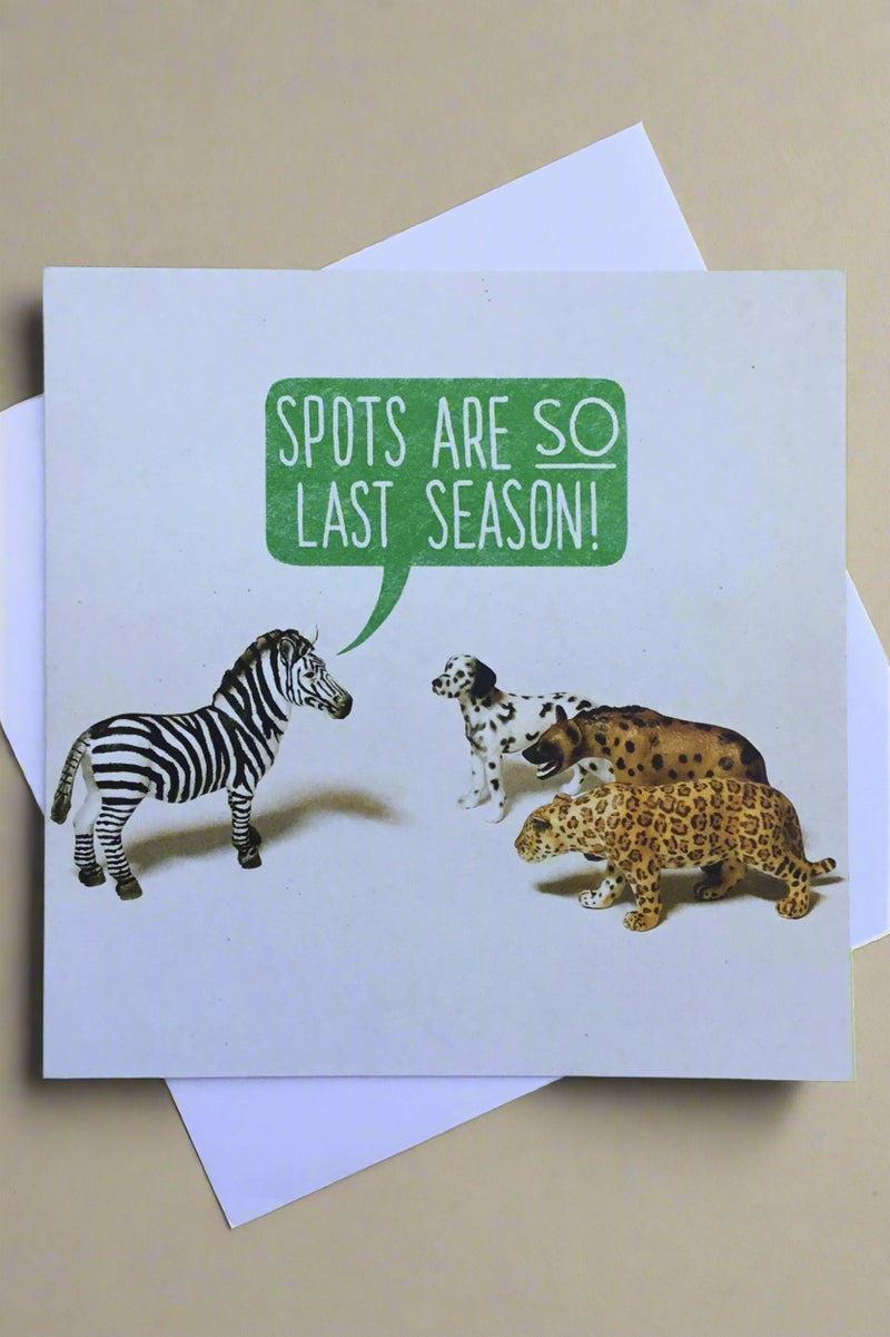 Card with image of three spotted animals and zebra with words “spots are so last season!”