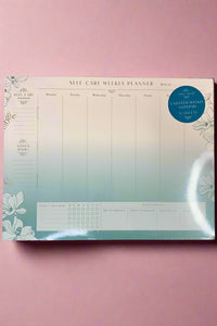 A notepad with weekly planner and space for notes on self-care.