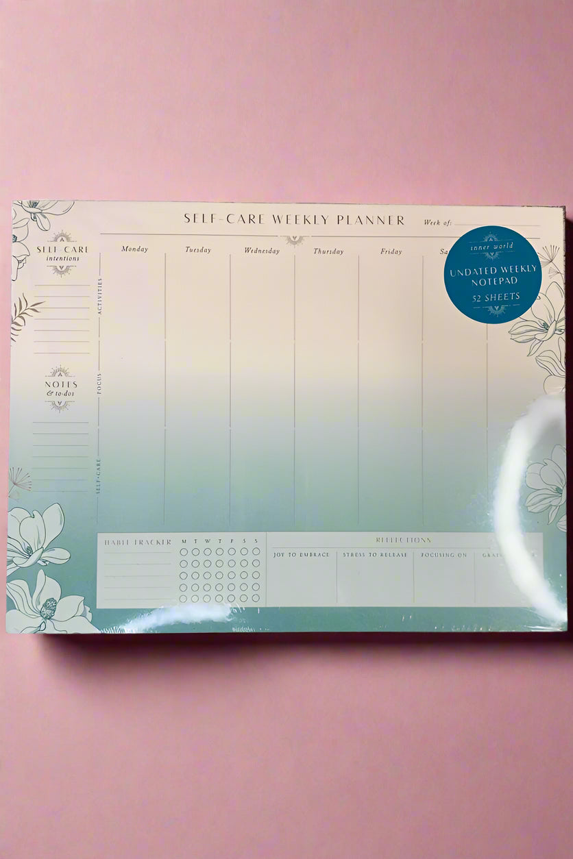 A notepad with weekly planner and space for notes on self-care.