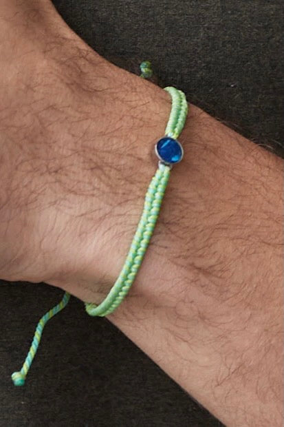A recycled plastic bracelet in green.
