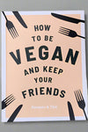 The cover of How To Be Vegan And Keep Your Friends: Recipes & Tips by Annie Nichols.