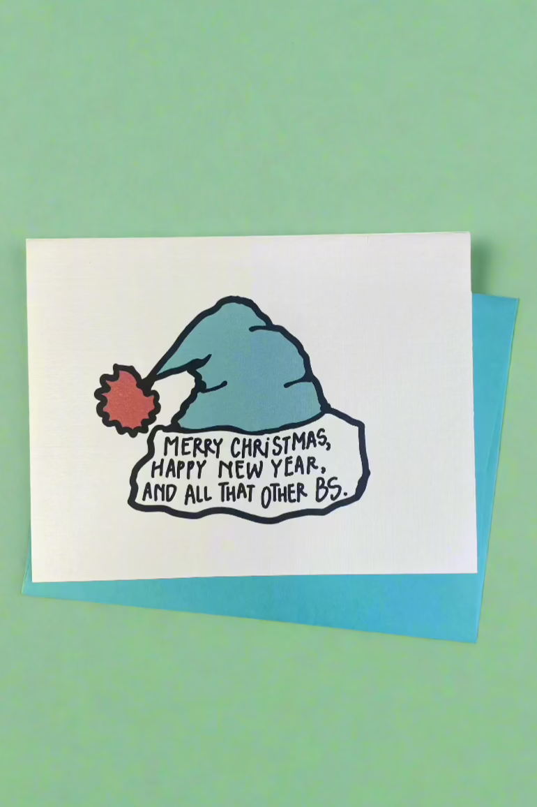 White card with an image of a Santa hat and the words “ Merry Christmas, Happy New Year, And All The Other BS.”