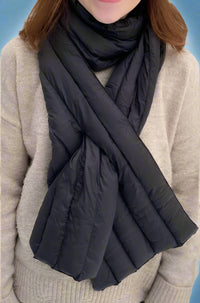 A down scarf with its own bag. It comes in black, grey, and olive.