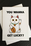 Card with a Maneki Neko and the words “you wanna get lucky?”