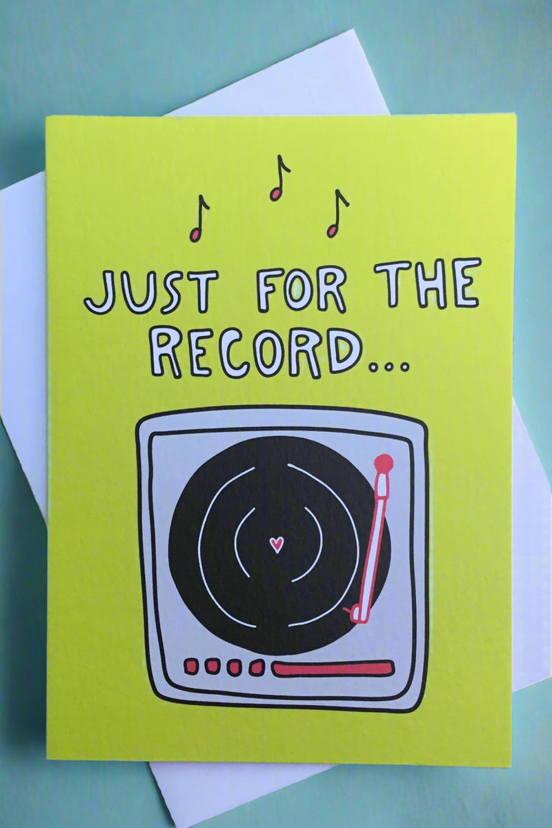 A green card with an image of a record player that says “Just for the record…”