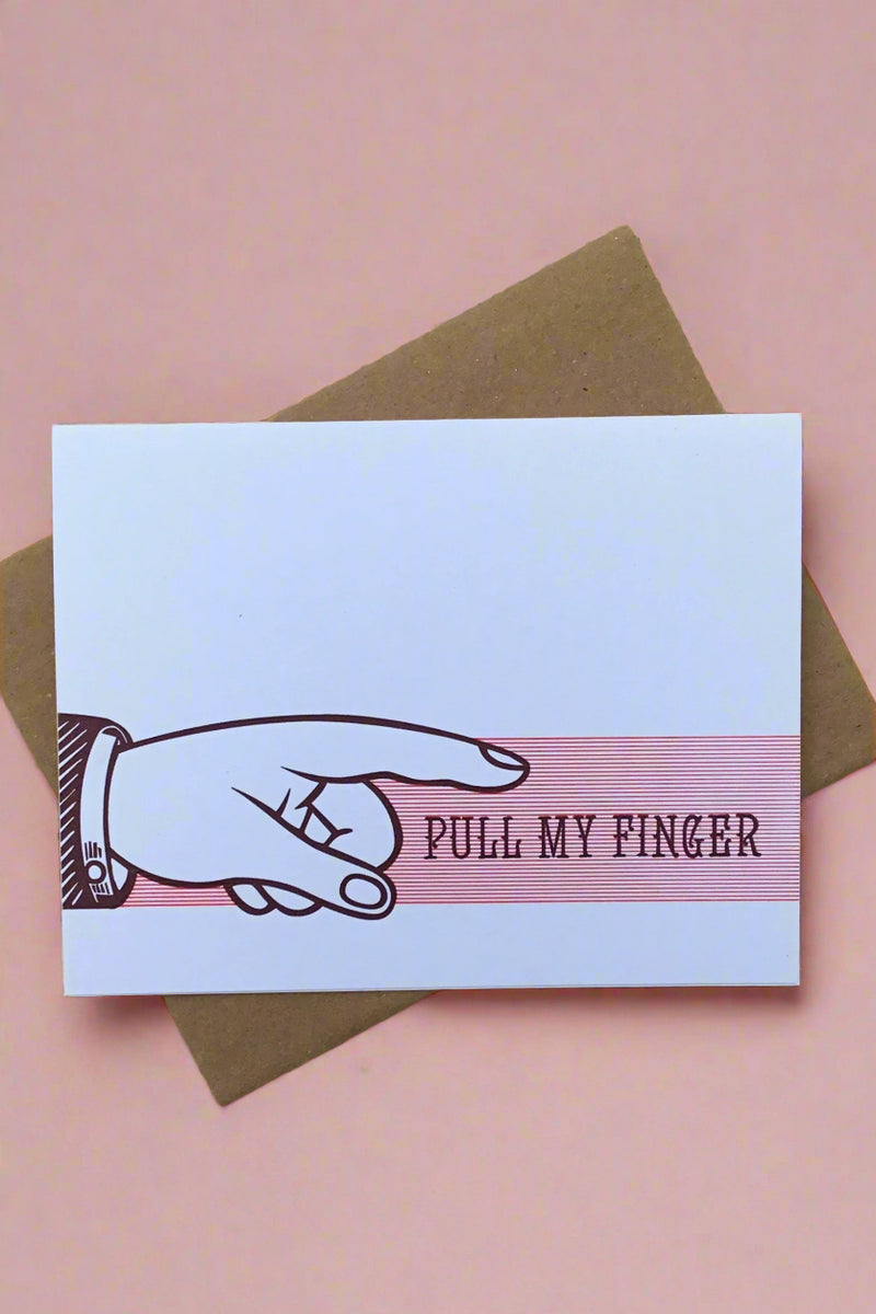 Card with image of a hand with pointed finger and words “pull my finger.”