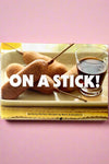 The cover of On A Stick!: 80 Party-Perfect Recipes, a cookbook by Matt Armendariz.