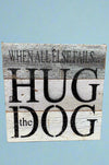 A square, weathered grey wood sign that says “when all else fails, hug the dog.”