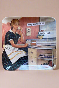 A small square trinket tray that has a vintage photo and funny phrase.