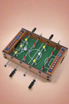 A mini foosball table game.